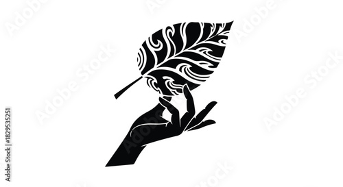 Delicate hand cradles intricately patterned leaf, symbolizing nature and artistry