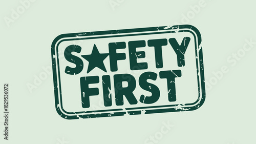 A green safety first stamp with a star on a light green background in a rectangular border frame
