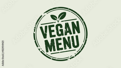 A green vegan menu stamp with leaves on a white background with a distressed circular border design