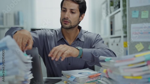 Exhausted executive struggling with an overloaded workload, feeling stressed and unhappy, contemplating support for burnout and mental health issues.
