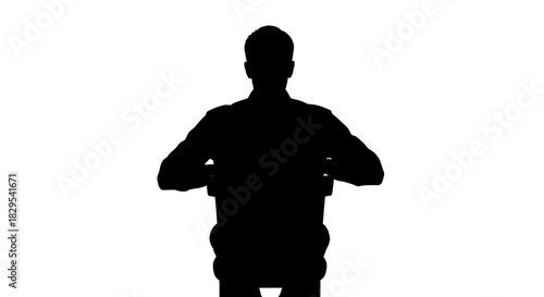 Silhouette of a person sitting on a chair with a white background in a studio setting view from behind