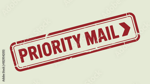 A red priority mail stamp with a border and an arrow on a slightly angled off white background