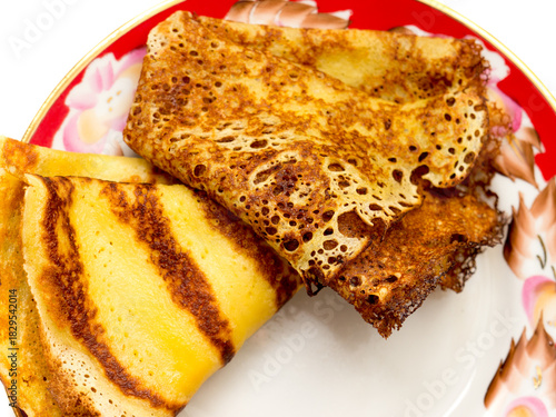 Pancakes lying on a plate.