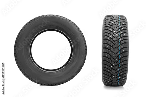 Winter tire with studs for a passenger car on white