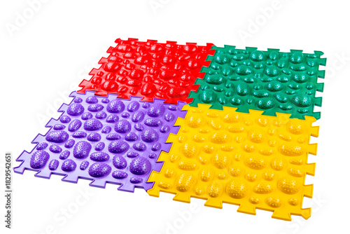 Multicolored foot massage mat on white