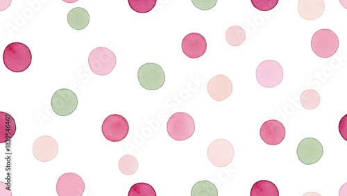 Seamless pattern of watercolor polka dots in shades of pink, magenta, and light green scattered randomly on a transparent background, perfect for fabric or wallpaper design