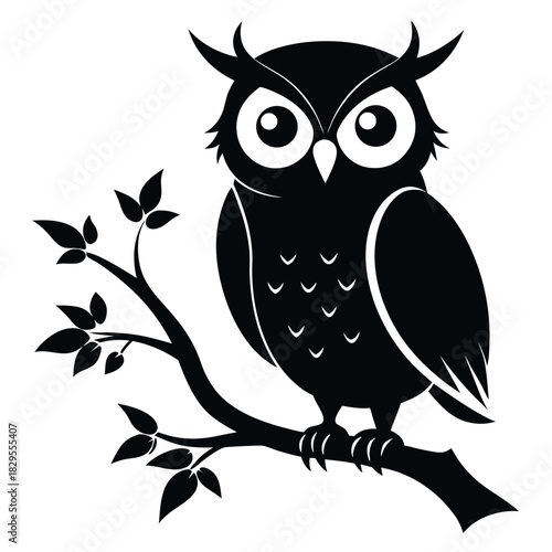 Solitary silhouette of an owl peacefully resting on a leafy branch in stark black