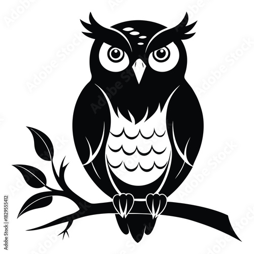 Bold monochrome owl perches silently on leafy branch, its intense gaze captivating the viewer