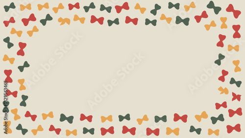 A frame of red yellow and green farfalle pasta on a beige background with a rectangular blank space inside