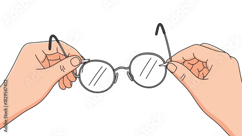 Two hands holding round glasses for vision correction, cleaning or adjusting spectacles