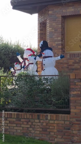 Vertical Daytime Exterior of Snowman Family Lawn Decorations