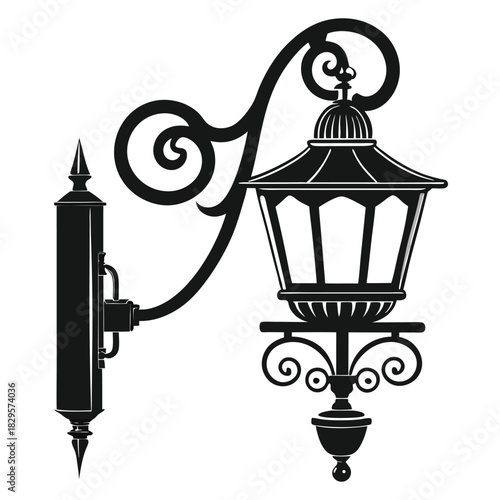 Ornate black wallmounted lantern showcases an antique vintage streetlight with elaborate curly design