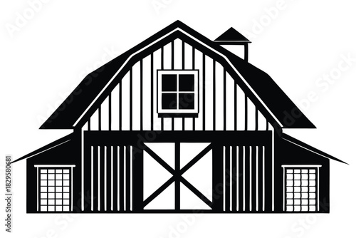 Imposing silhouette of a black barn features a prominent gable roof and distinctive windows