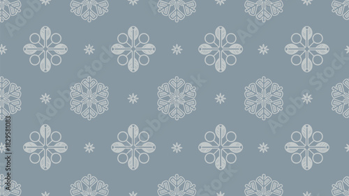 A seamless pattern of snowflakes and floral shapes on a blue background creating a wintery feel design