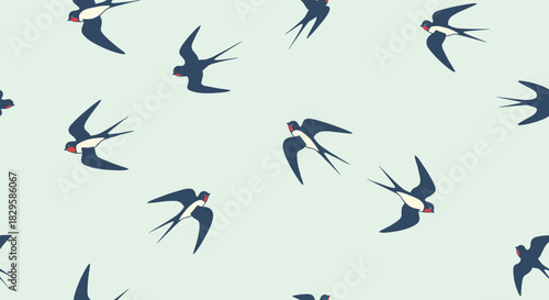 A simple and elegant seamless pattern of graceful swallows flying freely across a soft and pale blue-green colored sky.