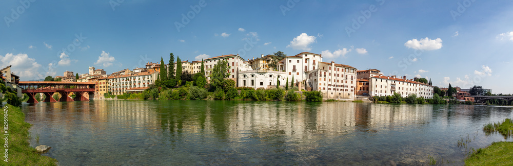 Fototapeta premium view to historic skyline of Bassano del Grappa with the Old wooden Bridge, also called ponte degli Alpini, Italy