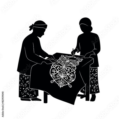 Batik artisans creating intricate designs on fabric.