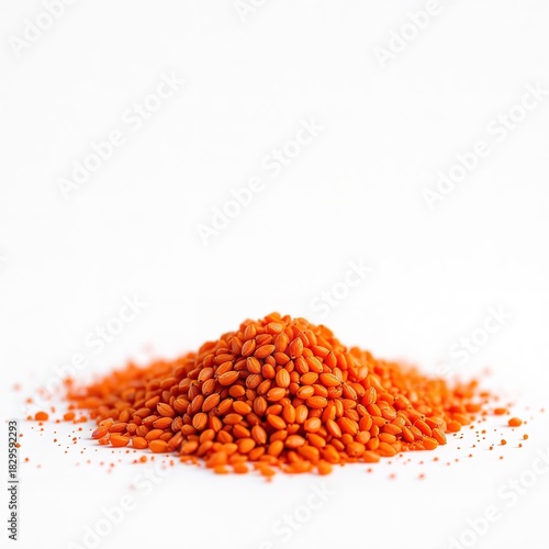 Stock photo of red lentils pile on white background for healthy food and vegan diet concept use, raw lentils