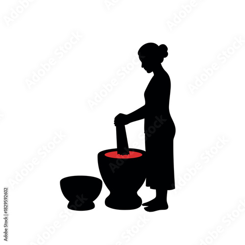 Silhouette of a woman using a mortar and pestle.