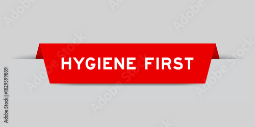Red color inserted label with word hygiene first on gray background
