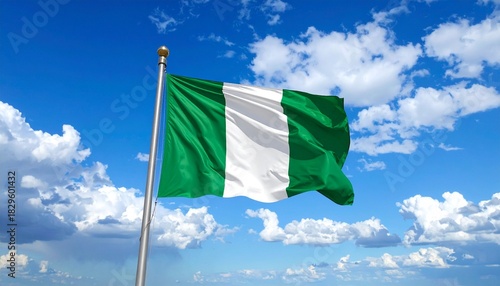 Nigerian Flag Waving Against Blue Sky