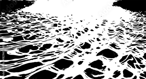 High-contrast close up of crackled ice surface forming intricate patterns.