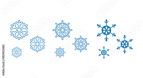 Collection of stylized blue snowflakes in various sizes and designs on a clean white background, ideal for winter icons, Christmas decorations, web graphics, packaging, patterns and seasonal design pr