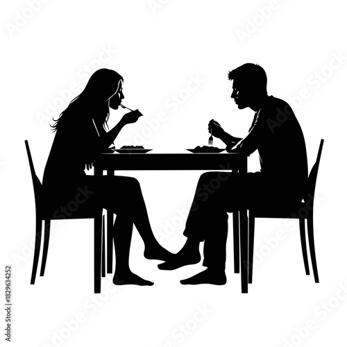 Silhouette of a man and woman having a romantic dinner at a restaurant table with chairs
