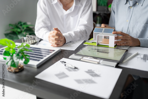 Solar panels green energy Business man working green eco friendly office business creative idea Planing Bio economy for business eco friendly professional Engineer sustainable electricity.