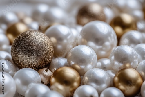 Close-up of many white and gold pearl-like Christmas ornaments