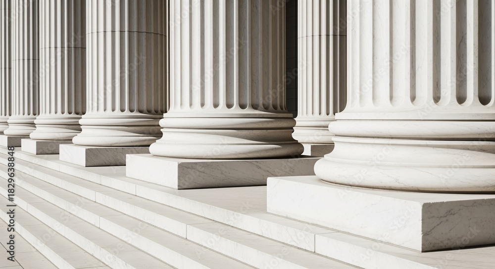 Naklejka premium White marble columns with stone bases line up on steps, showing classical style. Perfect for law, government, justice, education, and official building concepts. Timeless design detail.