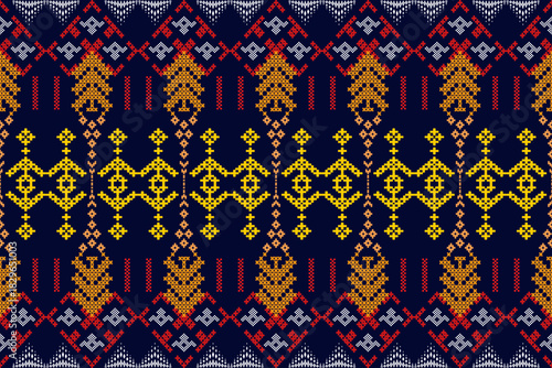 Seamless geometric ethnic cross-stitch pattern on dark blue background. Tribal embroidery style for textile.