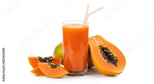 Glass of fresh papaya smoothie juice with straws and sliced fruit
