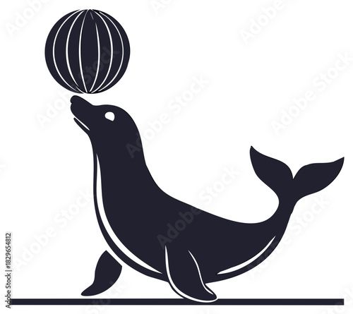 Silhouette of a skilled seal balancing a striped ball on its nose during a performance