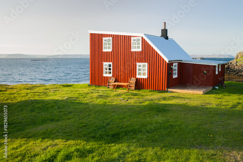 Little house on Flatey island in Iceland at midnight