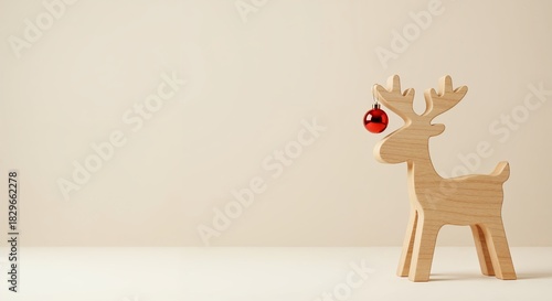 Minimalist wooden deer with Christmas ornament and copy space
