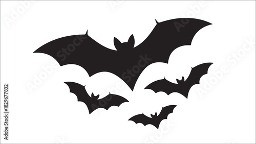 Silhouette of a swarm of bats flying against a light background