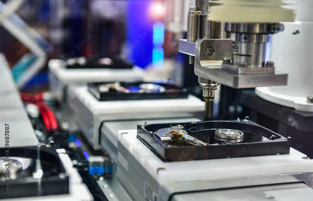 Fototapeta premium Automatic machinery for assembling and inspecting hard disk drives in the production line 