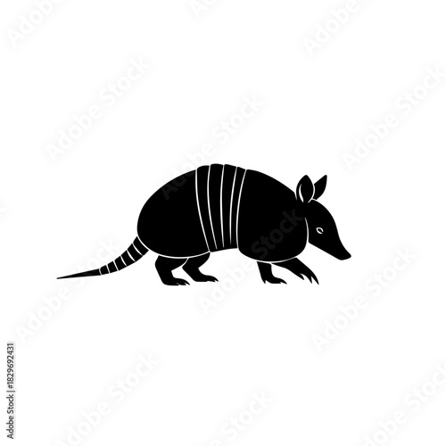 Black silhouette of an armadillo, a nocturnal mammal known for its armored shell.