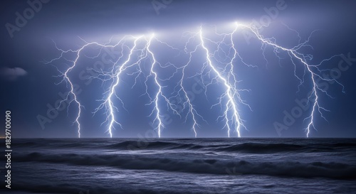Fototapeta Naklejka Na Ścianę i Meble -  Dramatic lightning strikes over ocean water during a stormy night