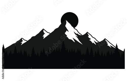 Silhouette of snow capped mountains and a forest under a dark moonlit sky