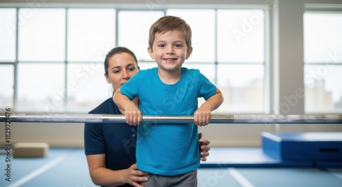 Young caucasian child with female instructor practicing gymnastics indoors