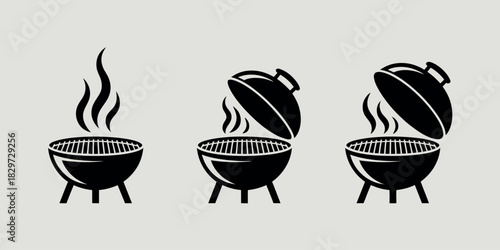 Three black barbecue grills with smoke and open lids
