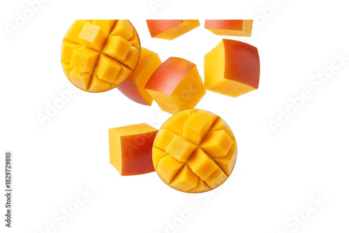Fresh mango pieces floating in the air on a black background