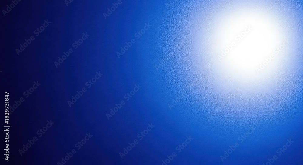 Obraz premium Bright Sunburst Light on Dark Blue Gradient Background