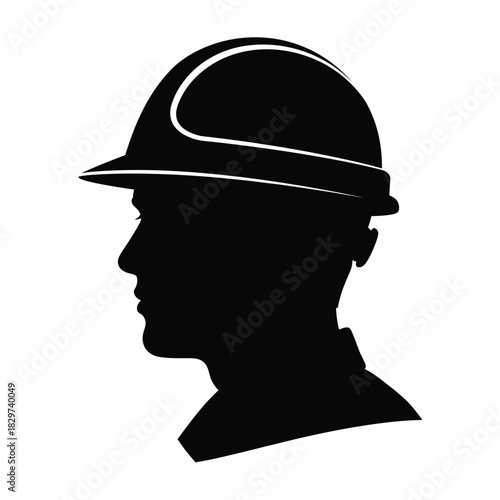 Silhouette profile of a construction worker wearing a hard hat and safety helmet, symbolizing industry and safety on white background