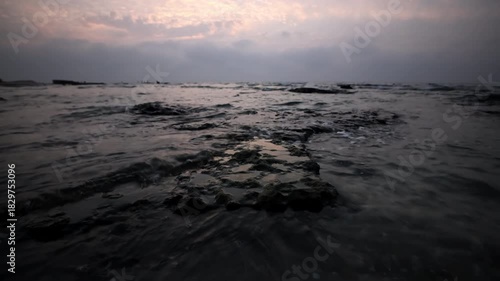 Rocky seashore at sunset in Palmachim, Israel

A calm twilight view of gentle waves washing over dark coastal rocks along Palmachim Beach, filmed in November 2025 in Israel.
