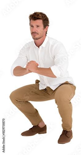 a man in a white shirt and brown pants performing a squat, isolated on a transparent background.