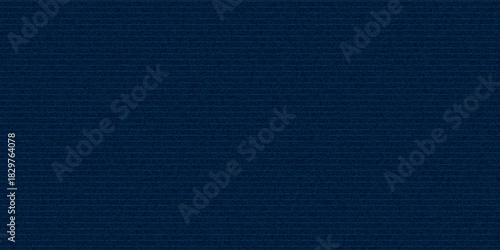 Navy blue cotton fabric pattern close up as background. Denim blue grunge textured seamless pattern. Dark navy blue denim jeans.