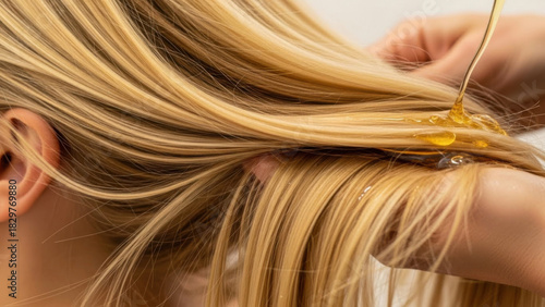 Applying oil to blonde long hair